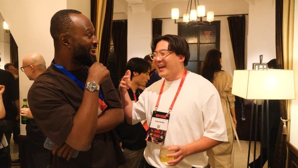Babatunde networking at IVS in Kyoto